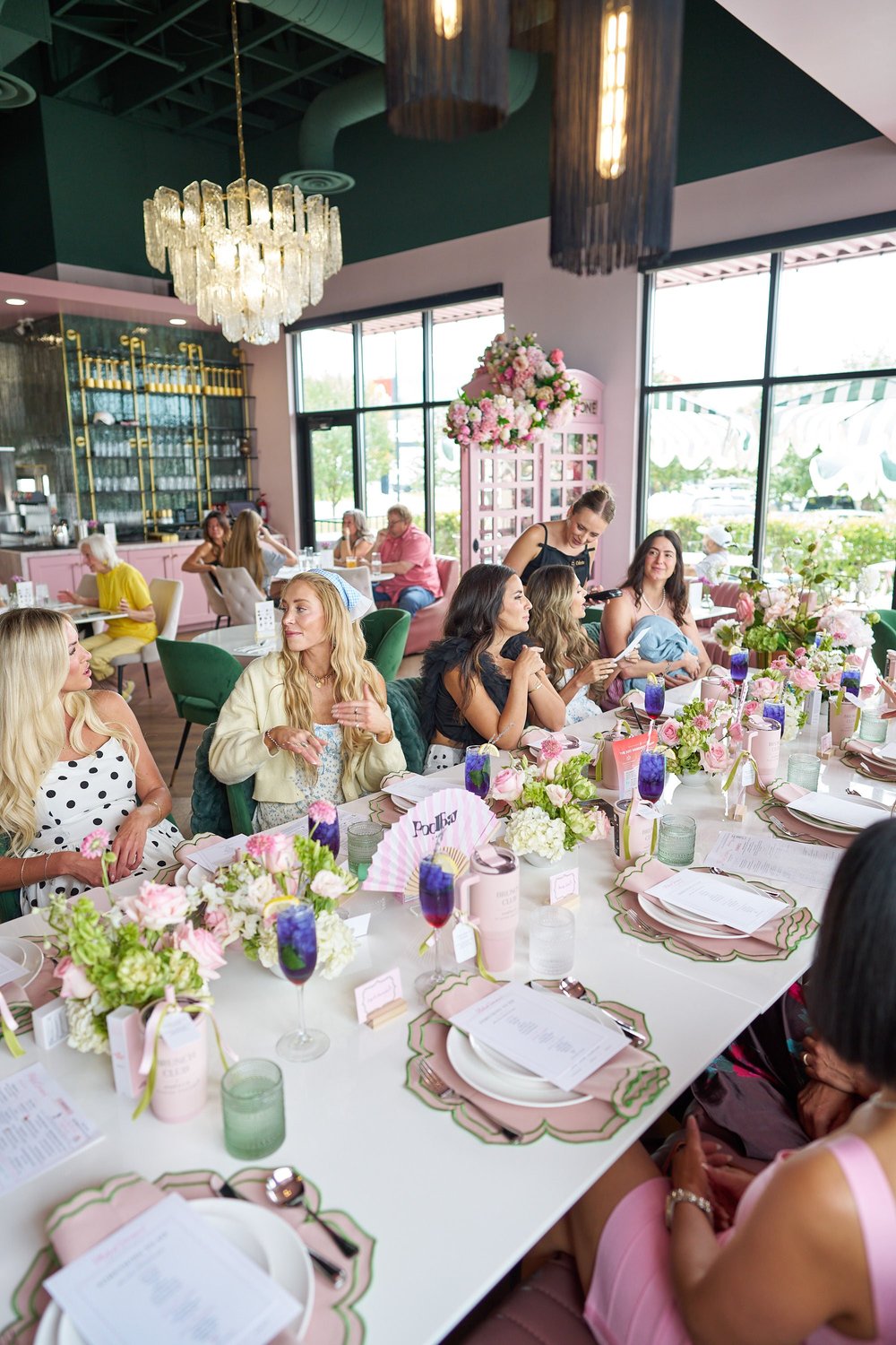 The pink phone booth behind a long celebration table
