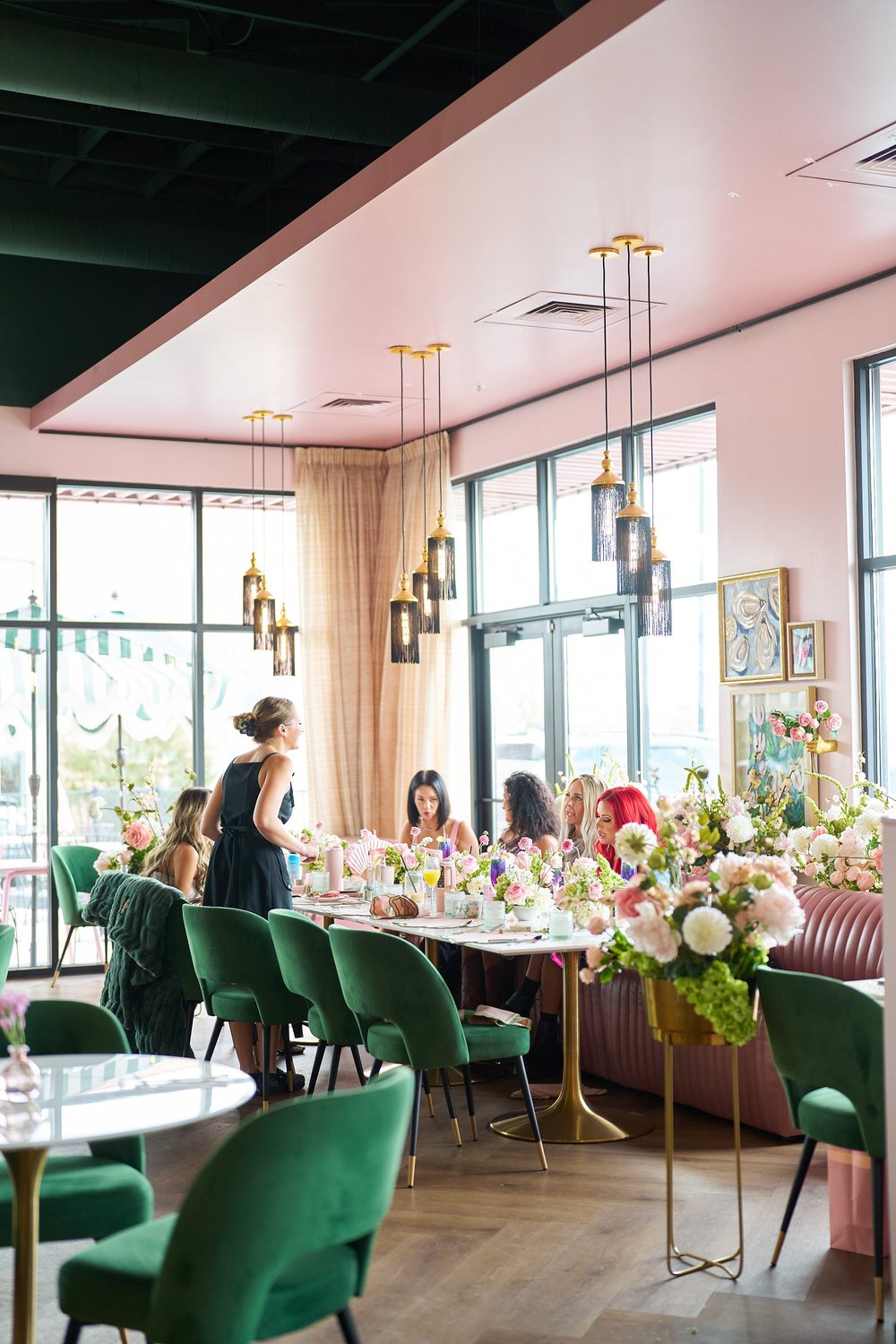 Emerald chairs and brass pendant lights