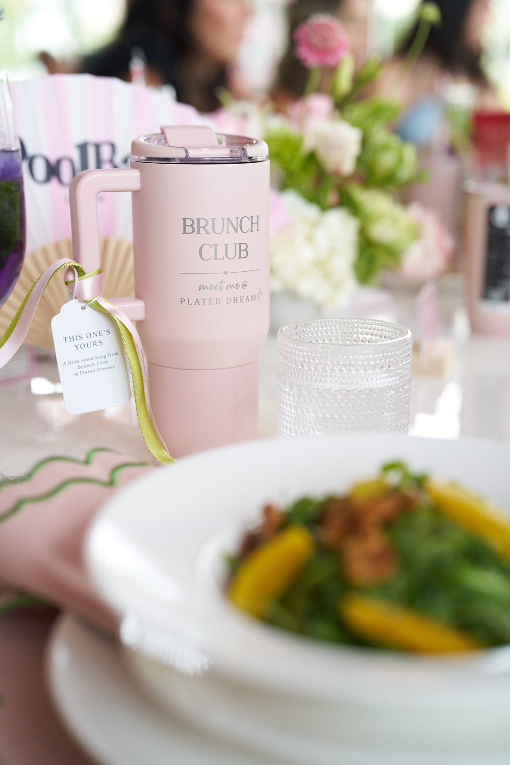 A blush Brunch Club tumbler on a set table